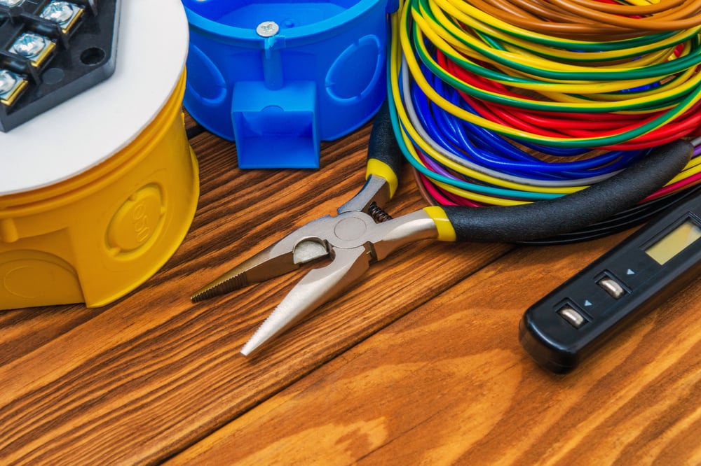 Electrical junction boxs with cables wire and tools used in the electric installation process